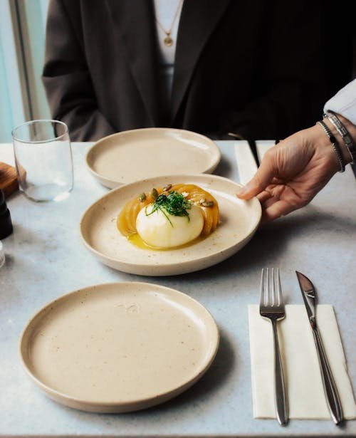 Free A sophisticated dining setup with burrata cheese dish being served at an Istanbul restaurant. Stock Photo